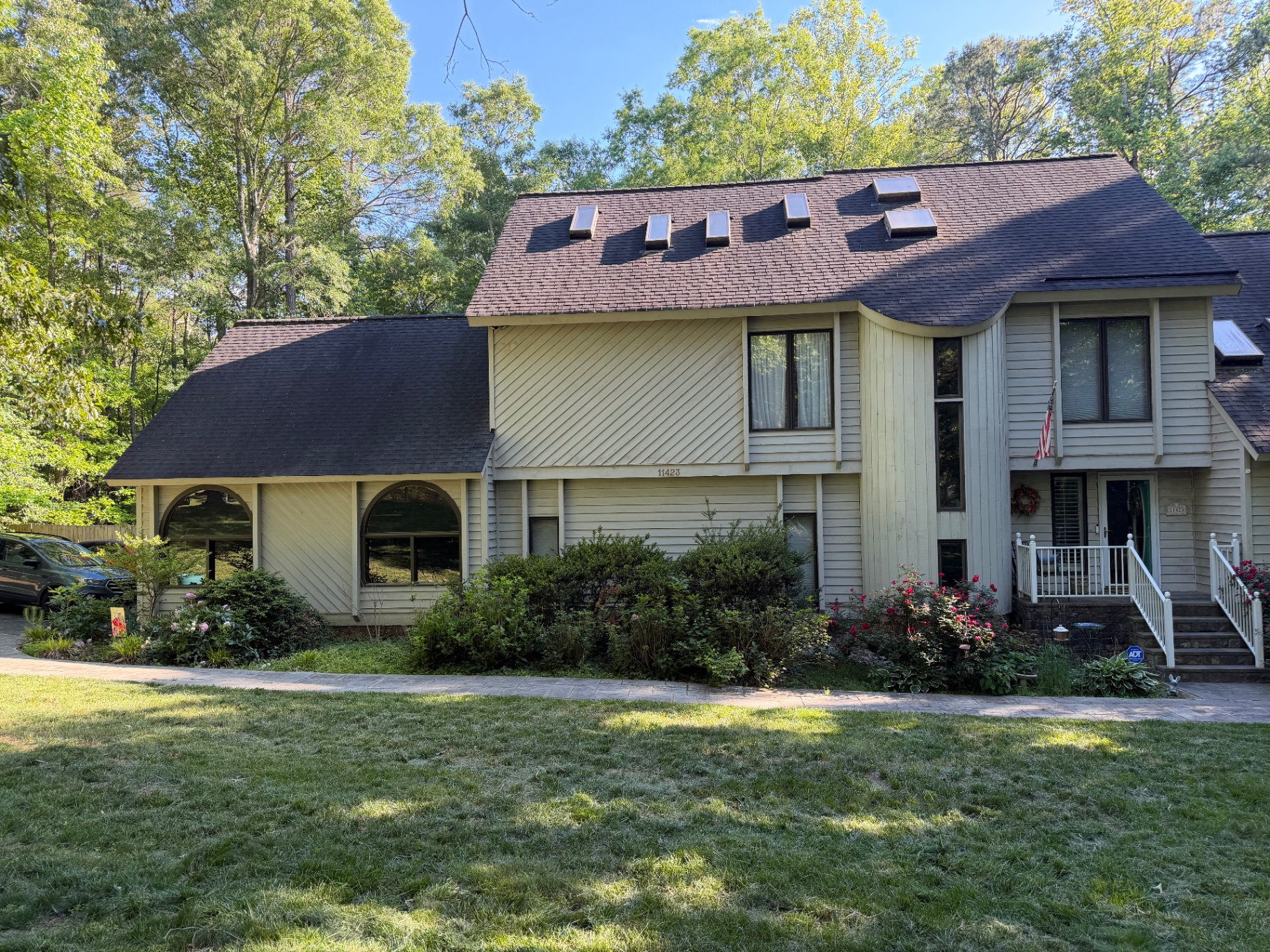 Before: overgrown foundation shrubs and tired beds